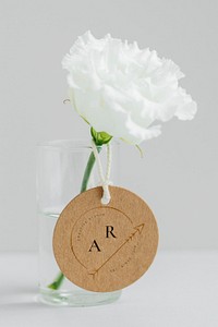 White peony in a cleared vase with a tag mockup