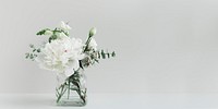 Bouquet of white flowers in a cleared vase