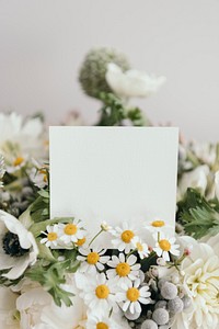 Bouquet of white flowers with a blank card