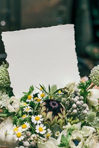 Bouquet of white flowers with a blank card