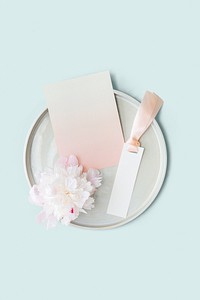 Blank floral label mockup on a plate