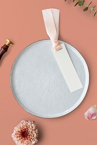 Blank floral label mockup on a plate