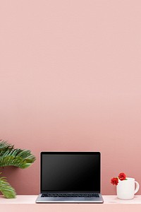 Laptop mockup with a pastel pink wall