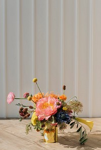 Gold vase with fresh flowers