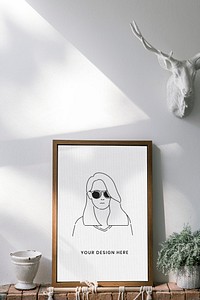 Wooden frame mockup against a white wall