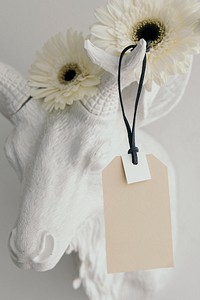 Tag mockup on a deer head decorated with flowers