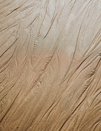 Beige sandy beach texture background