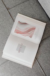 Pink notebook mockup on the floor