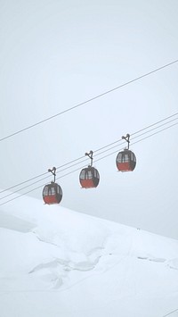 Cable car passing through the French Alps mobile phone wallpaper