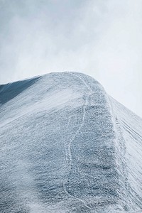 Cloudy snow covered Aiguille du Midi