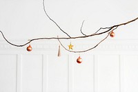Fesive Christmas ornaments on a branch