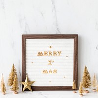 Golden merry Xmas in a wooden frame