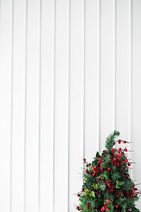 Christmas tree decoration with a white wall paneling