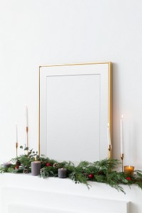 Festive golden photo frame against a white wall