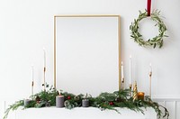 Festive golden photo frame against a white wall