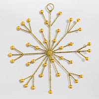 A gold snowflake Christmas ornament isolated on gray background
