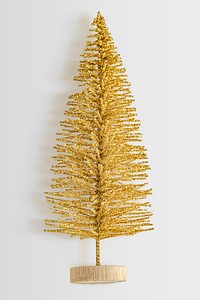 A gold Christmas tree ornament isolated on gray background