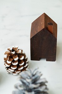 Pinecone and a wooden house Christmas ornament