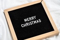 Merry Christmas on a wooden frame
