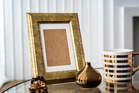 Golden frame by a golden mug