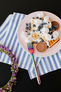 Blueberry and marshmallows over crispy extra everything waffles