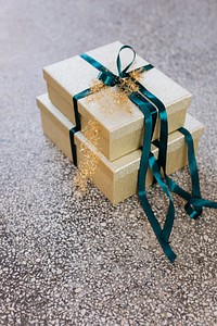 Wrapped golden gift boxes on the floor