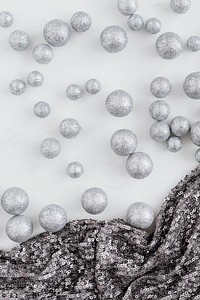 Glitter silver baubles and sequin textile