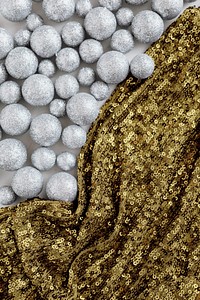 Glitter silver baubles and gold sequin textile