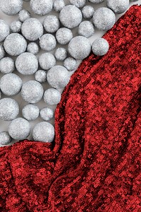 Glitter silver baubles and red sequin textile
