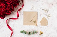 Roses by a brown paper card 