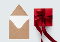 Red present by a brown envelope mockup
