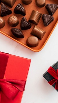 Chocolates by a box of red present mobile screen wallpaper