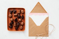 Chocolates in a tray by a card 
