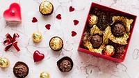 Chocolates in a box on a marble texture background