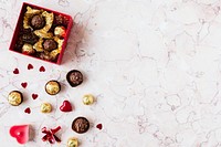 Chocolates in a marble texture background