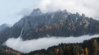 Dolomites valley shrouded by the mist