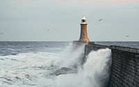 Huge wave hitting a lighthouse in Scotland
