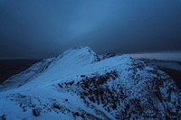 Snowy mountain top at night