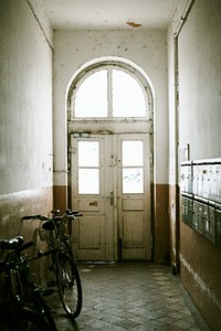Bicycle parked in an old hallway
