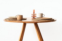 Cup and plate on round wooden table