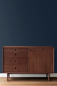 Mid century modern wood cabinet by a blue wall mockup