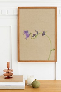 Picture frame mockup over a wooden sideboard table