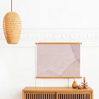 Poster hanger mockup over a wooden sideboard table