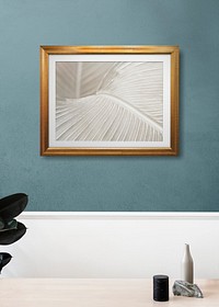Wooden frame mockup hanging on a blue wall 