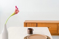 Wooden sideboard by a white wall