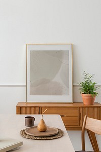 Photo frame mockup on a sideboard in a dining room