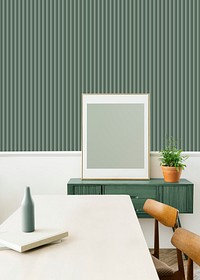 Blank frame on a green wooden sideboard