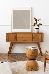 Picture frame mockup on a wooden sideboard table