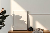 Blank wooden frame on a bench in a modern living room