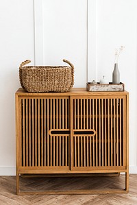 Wicker basket on a vintage wood cabinet